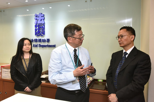 Picture 2 shows the Secretary for the Civil Service, Mr Clement Cheung (right) is briefed by front-line staff members of the Information and Application Services Unit about their work on provision of enquiry and appointment services to the public while touring the Application and Processing Division.